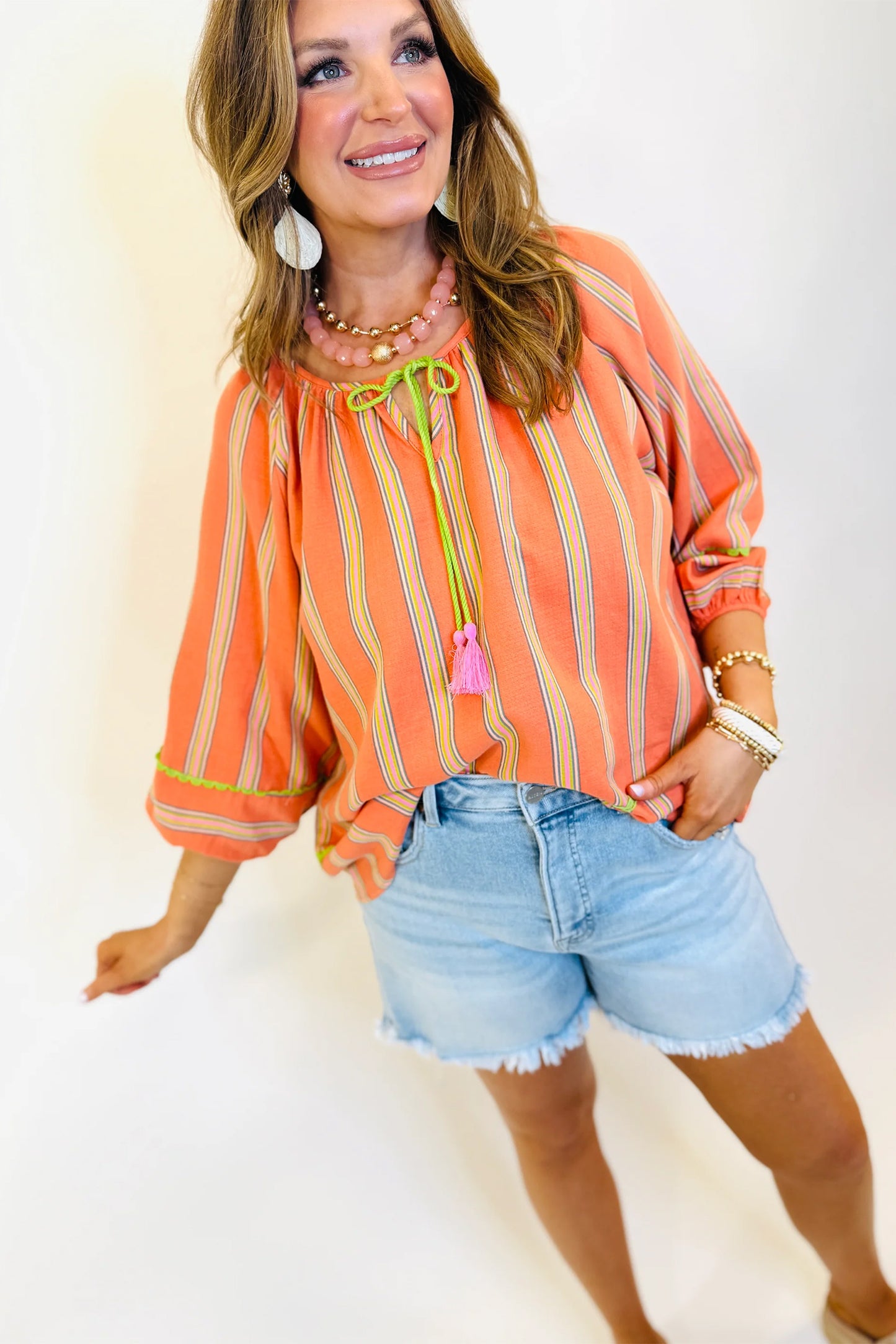 Orange Stripe Tassel Tie Neck Blouse